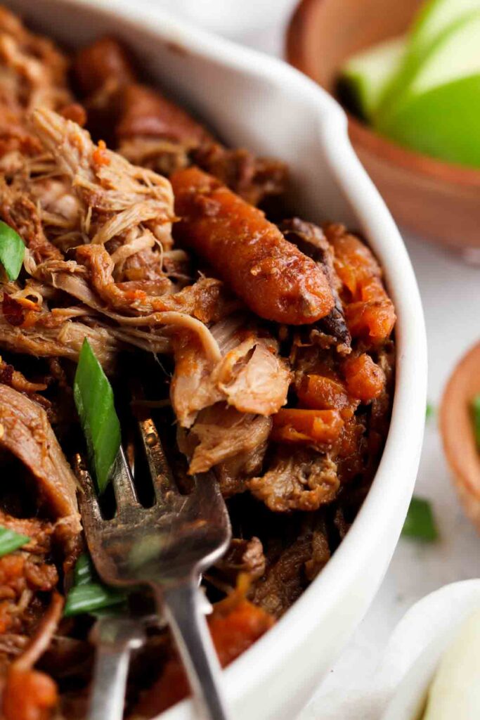 close up picture of pulled pork in a bowl
