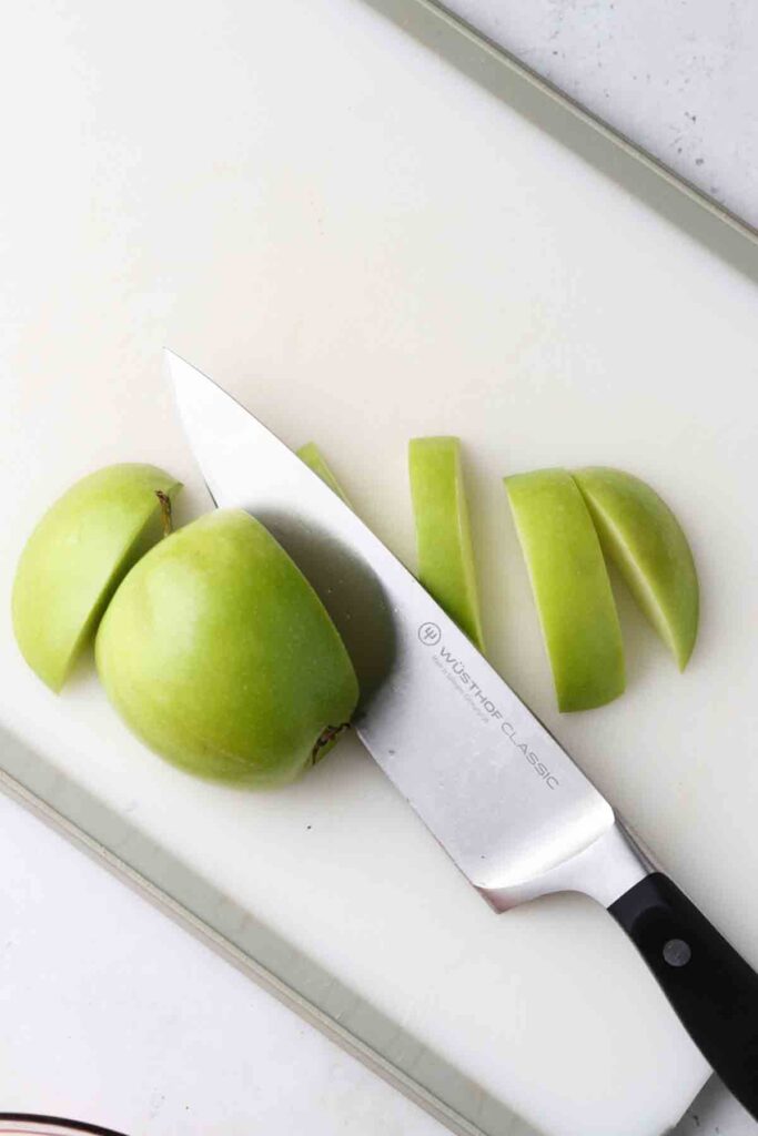 sliced apples on a cutting board