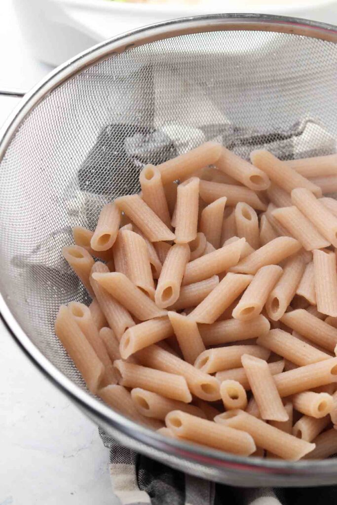 gluten free noodles in a strainer