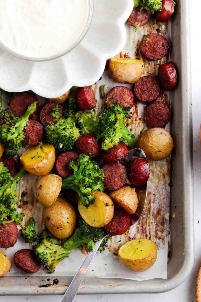 broccoli, sausage, and potatoes on a sheet pan