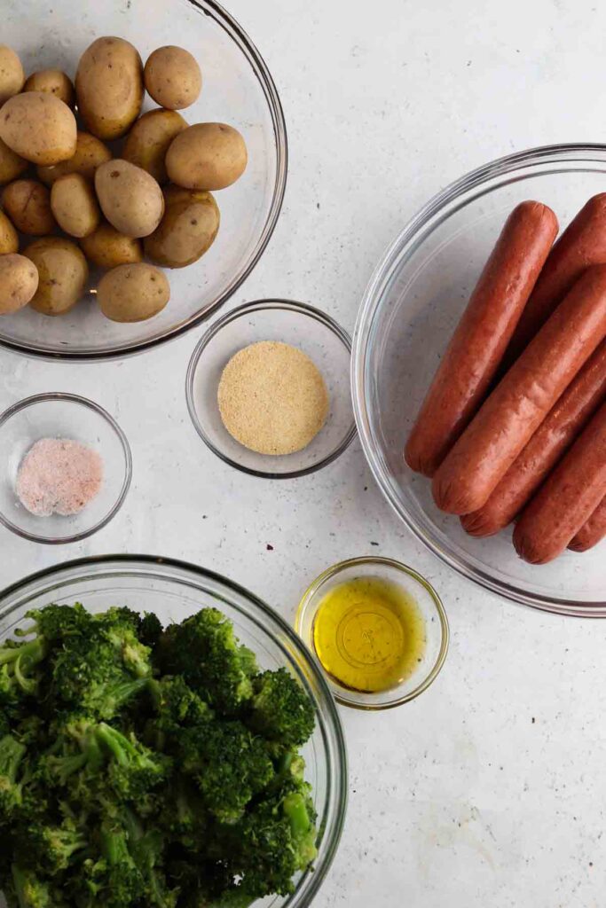 sheet pan ingredients laid out in bowls