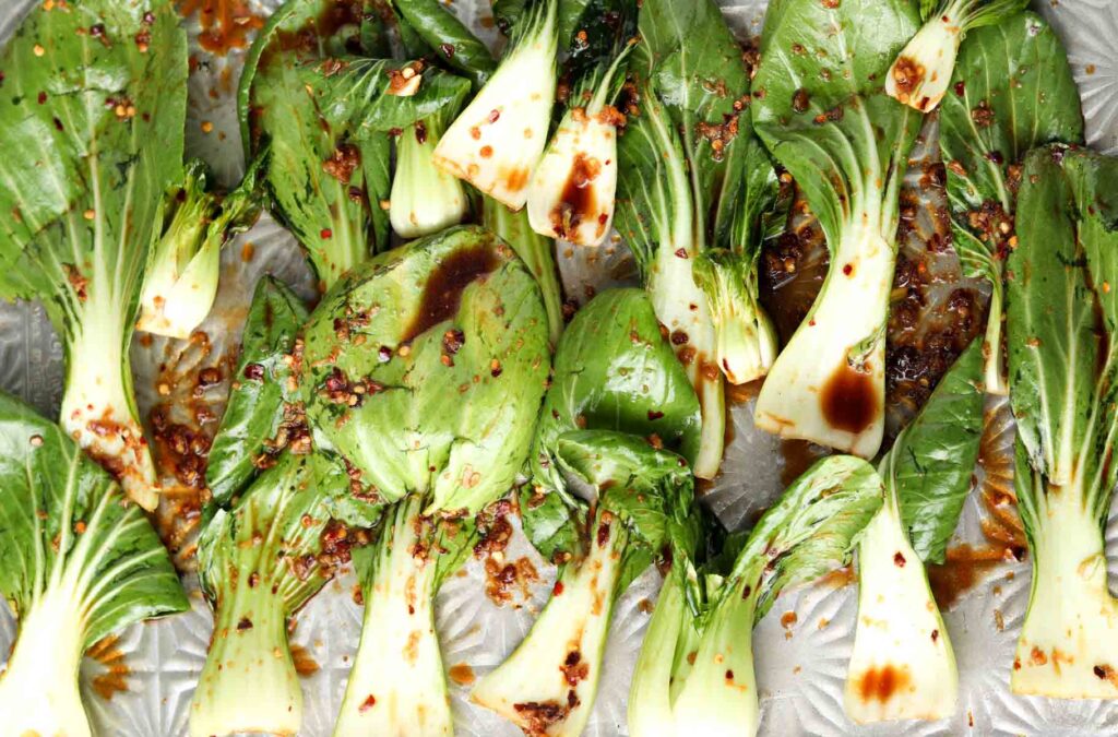 raw bok choy on a baking sheet