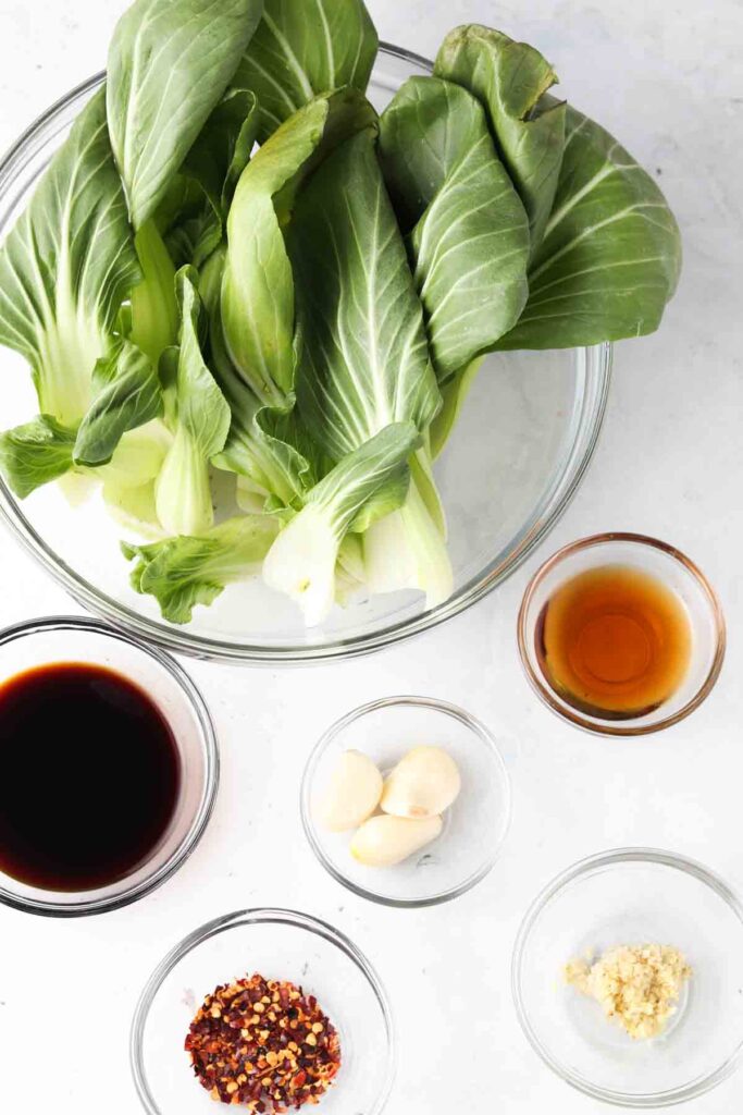 ingredients laid out in bowls on a sheet pan