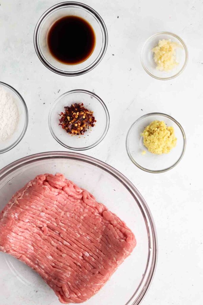 meatball ingredients laid out in bowls