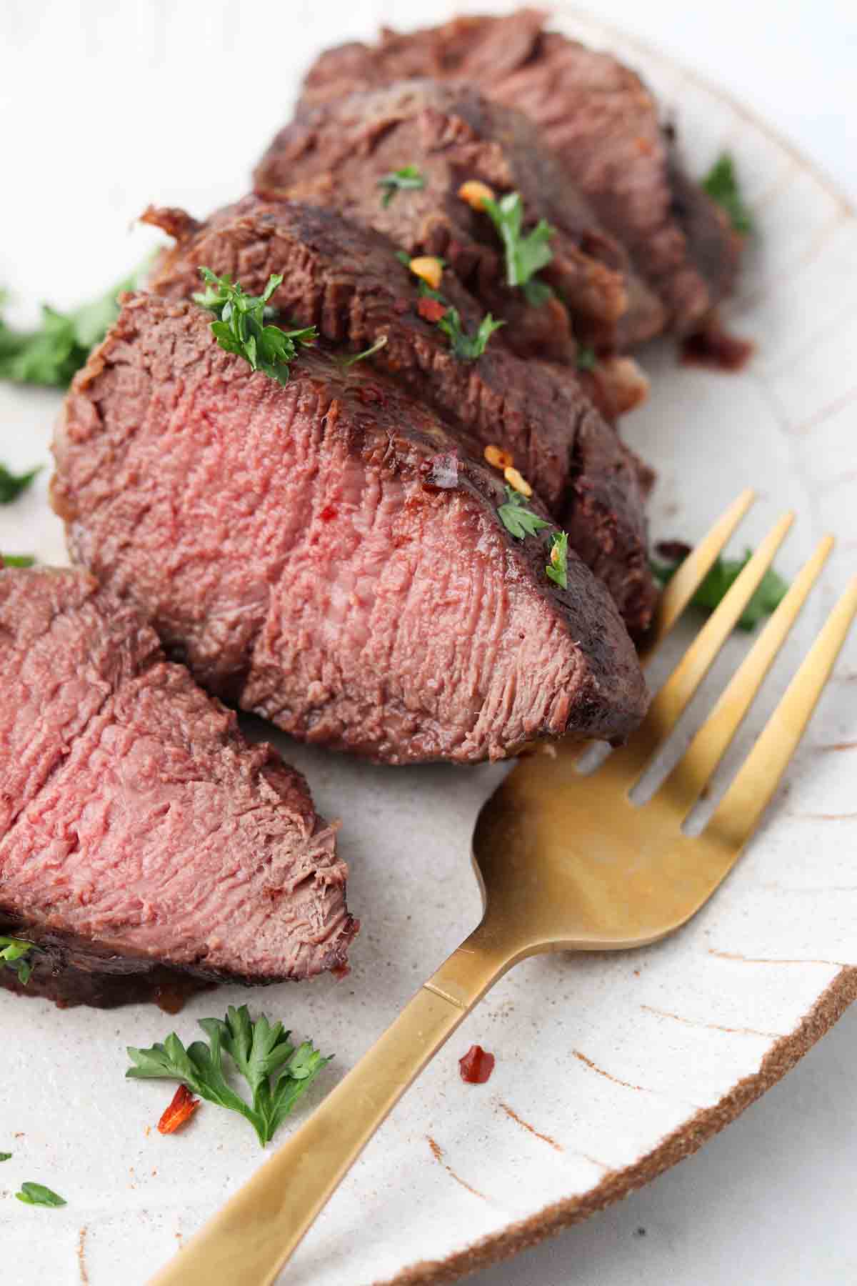 Juicy filet mignon on a plate.