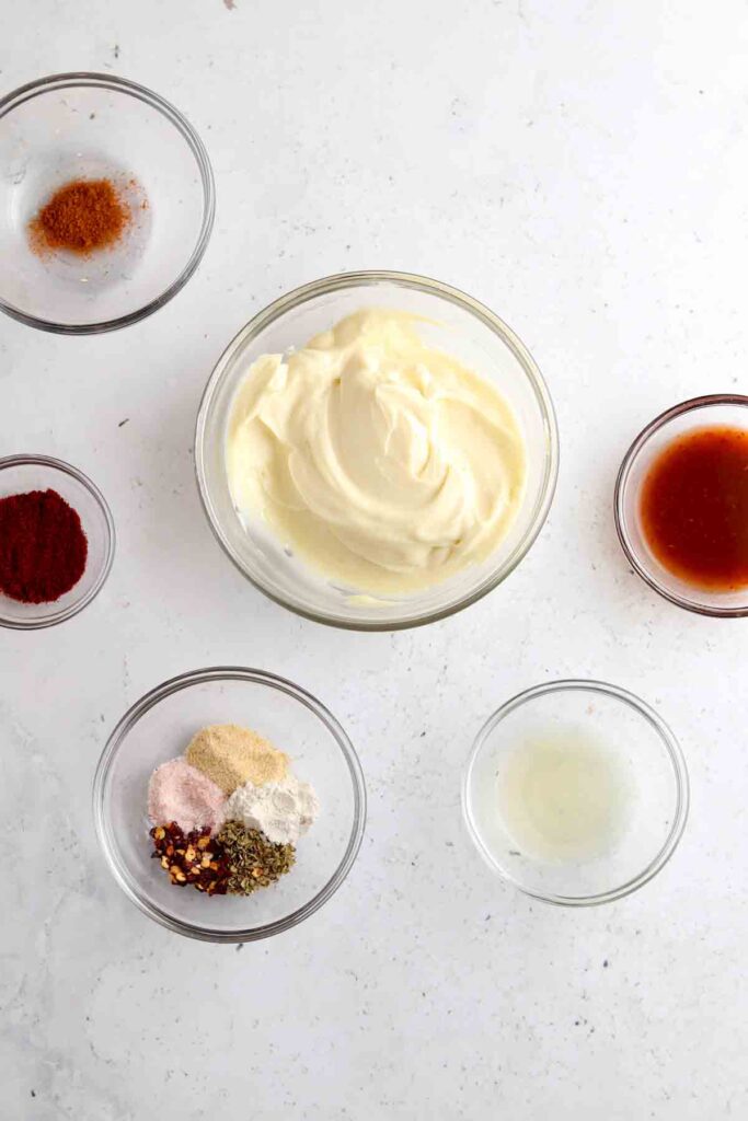 aioli ingredients laid out in bowls