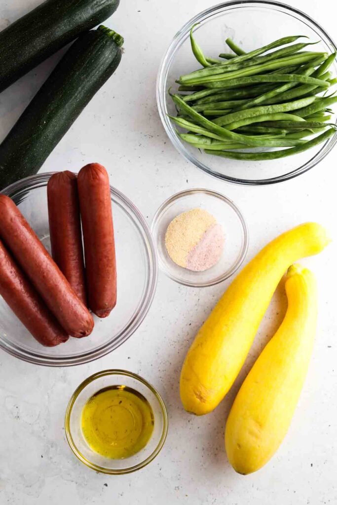 sheet pan ingredients laid out in bowls