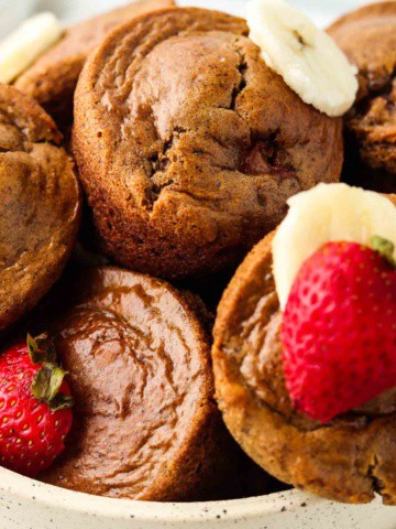 Close up photo of strawberry gluten free muffins in a bowl.