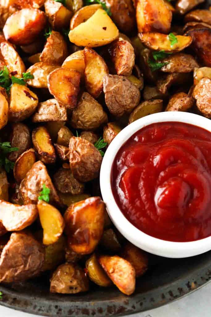 home fries and ketchup in a bowl