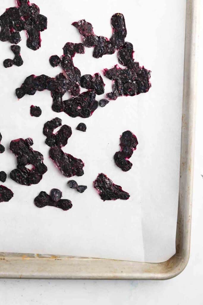 dehydrated blueberries on a sheet pan