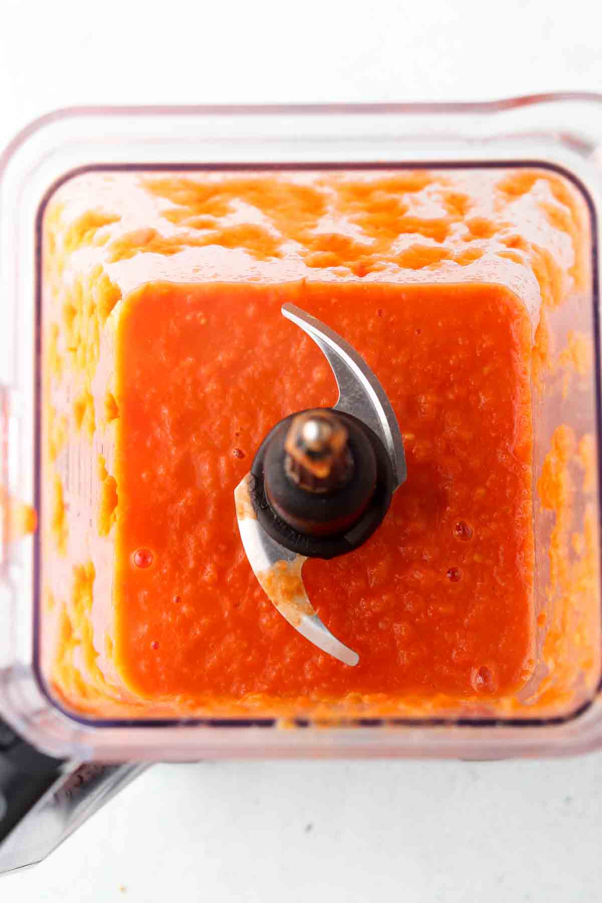 Smooth tomato soup in the food processor. 