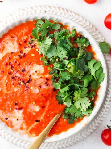 overhead shot of red soup in a bowl