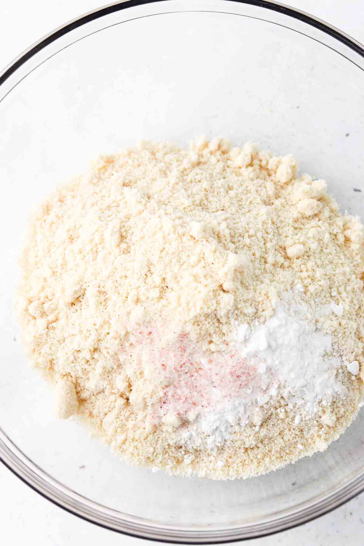 Almond flour, baking soda, and sea salt in a glass bowl.