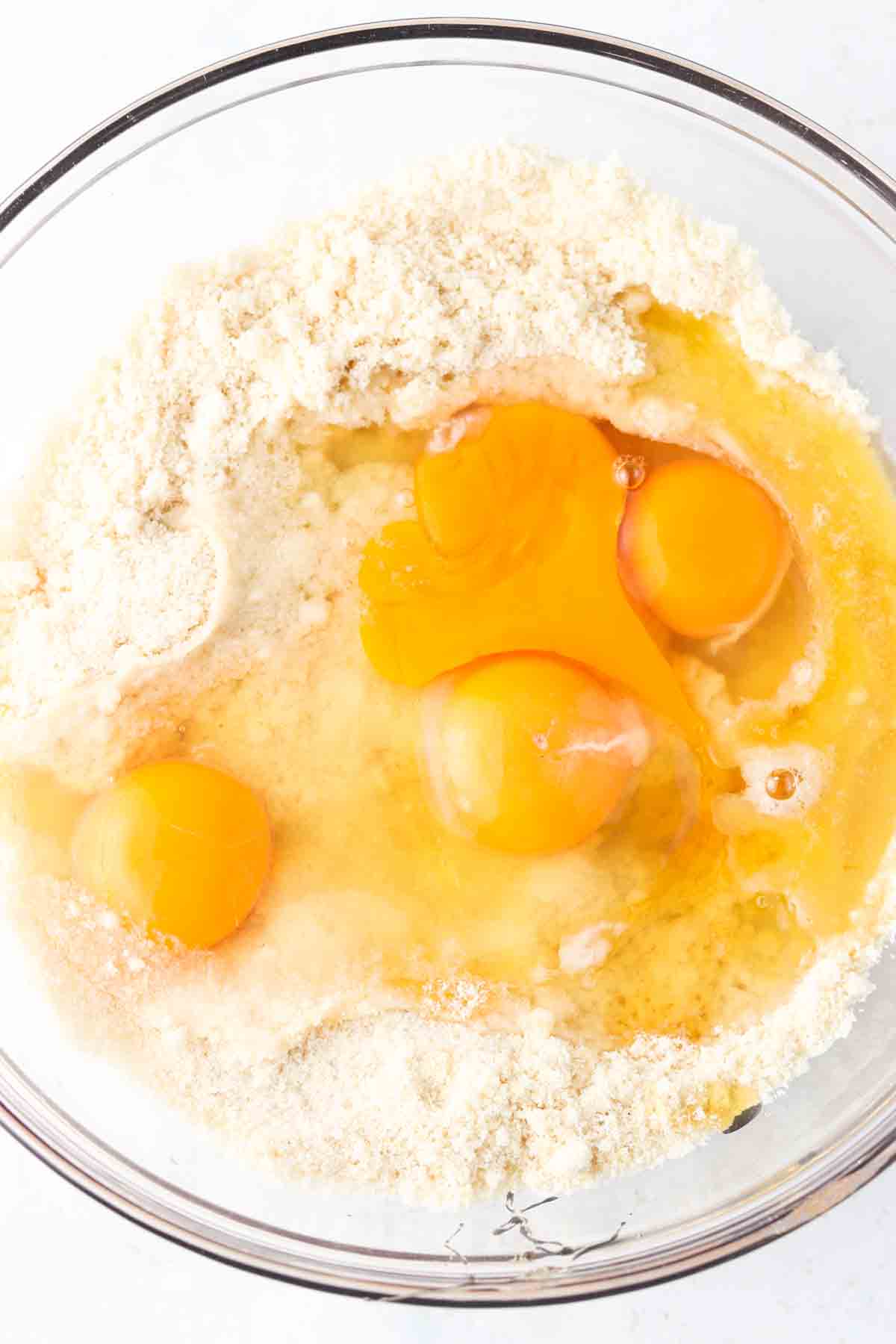 Eggs mixed in with almond flour, sea salt, honey, and baking soda.