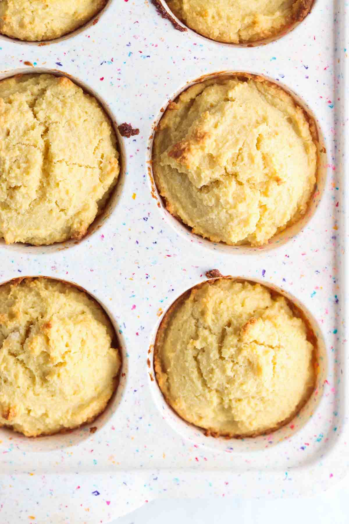 Biscuits inside a muffin pan mold.