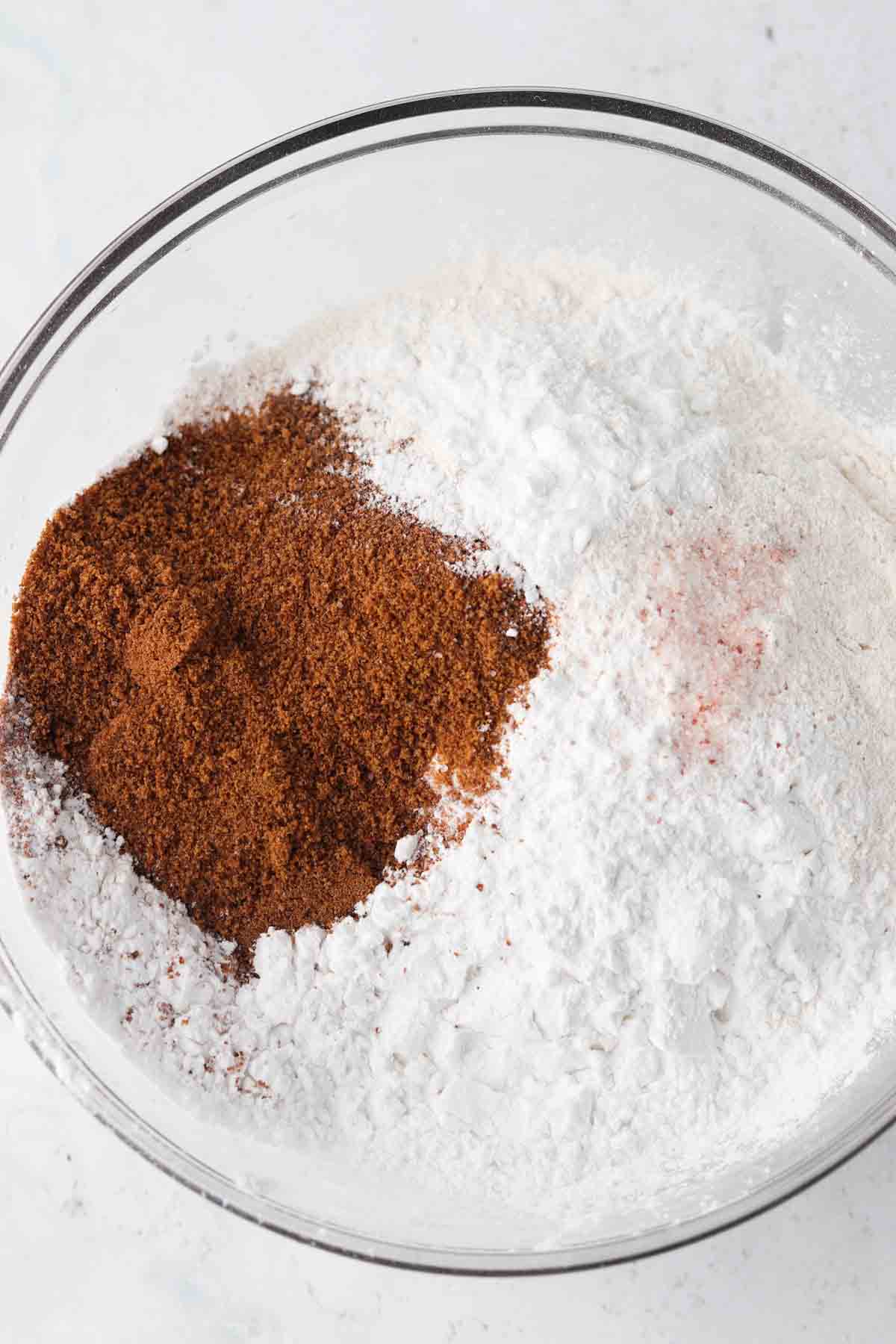 Dry ingredients in a bowl for peach cobbler.