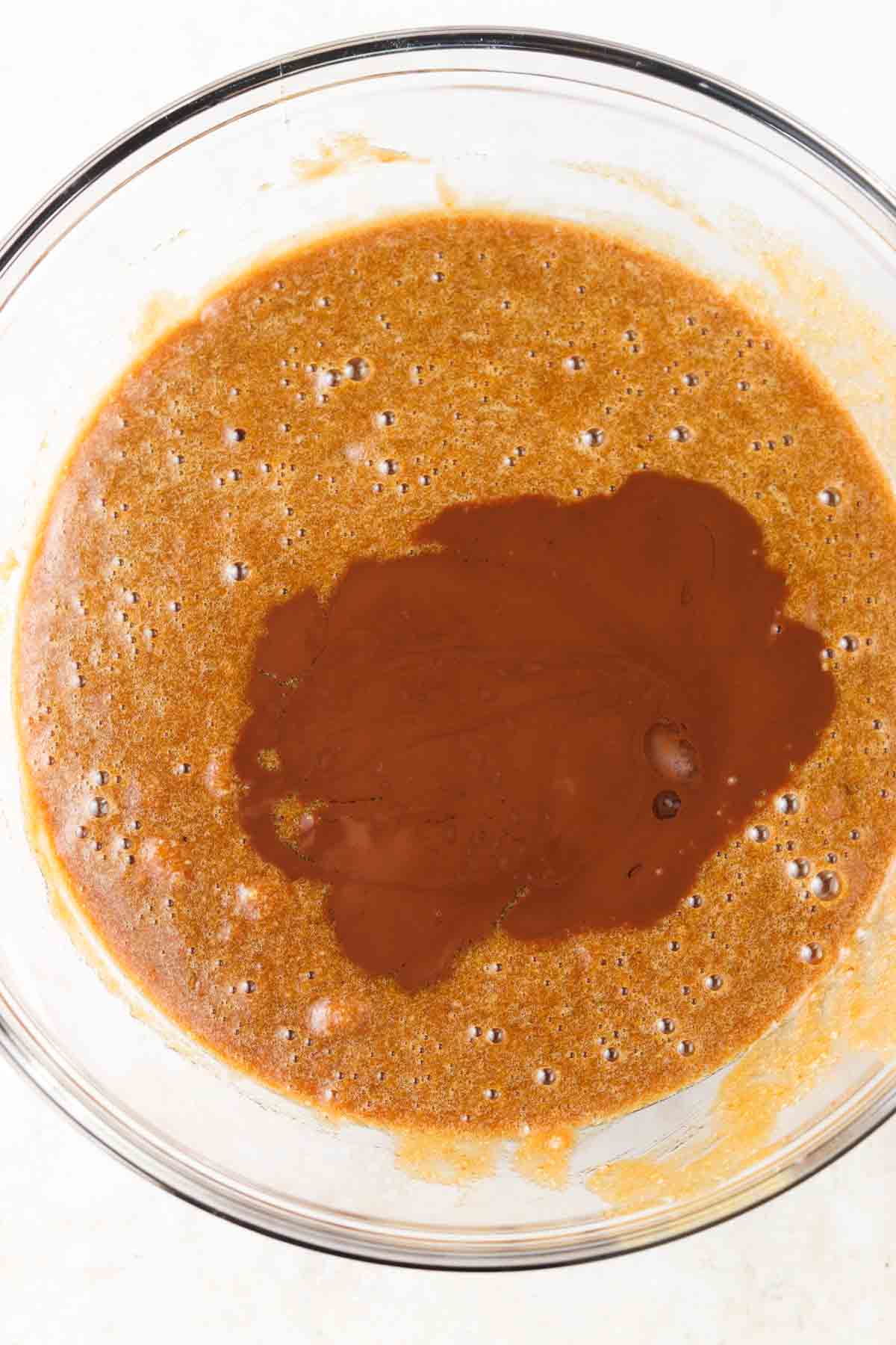 Coconut sugar, almond flour, eggs, dairy free chocolate, coconut oil and salt in a bowl.