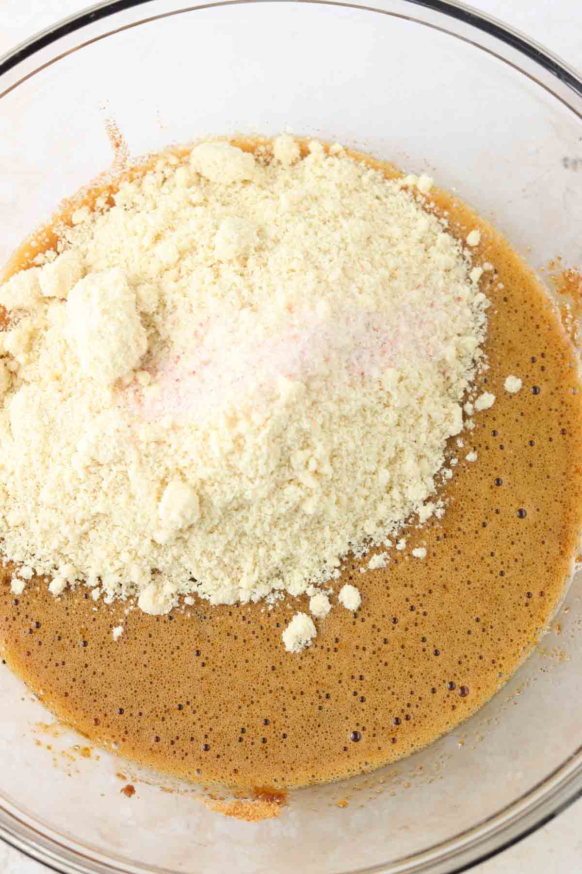 Coconut sugar, eggs, almond flour and salt in a bowl.