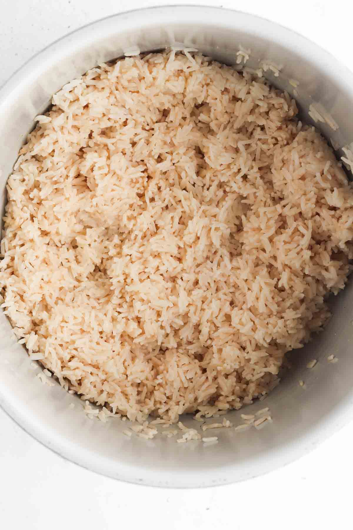 Cooked coconut rice mixed well throughout in the instant pot.