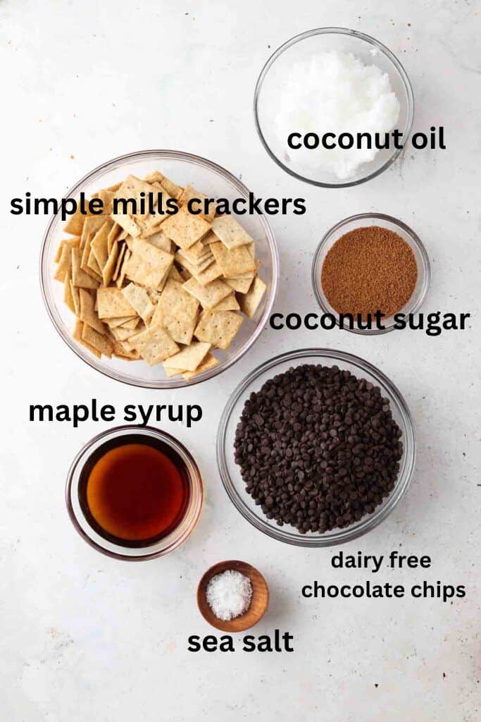 vegan christmas crack ingredients in small glass bowls on a marble backdrop