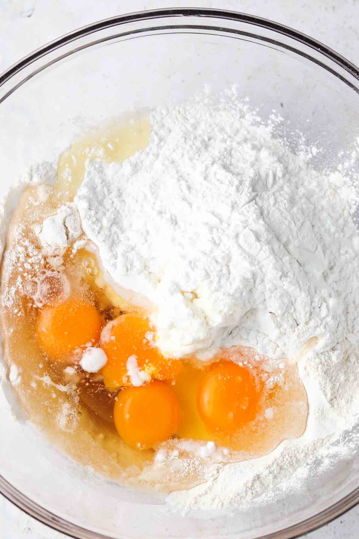 All dough ingredients mixed in a large glass bowl. 