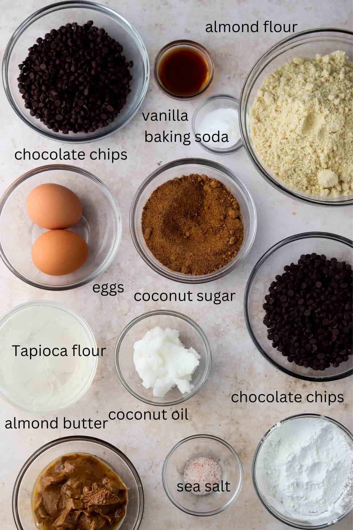 Gluten free cookie cake ingredients in small glass bowls.