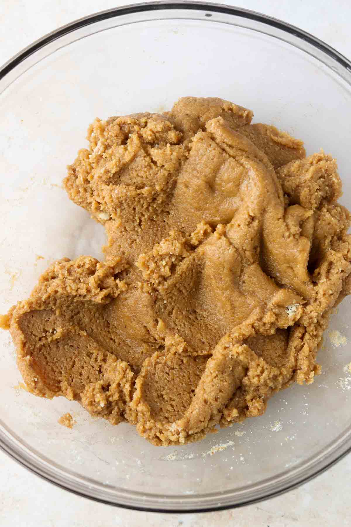 Gluten free cookie cake dough in a bowl.