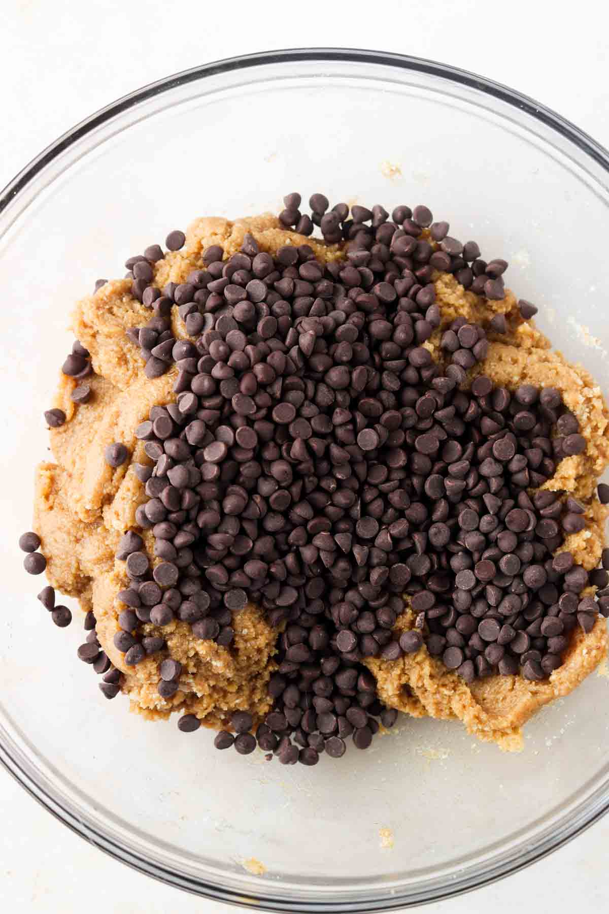 Chocolate chips mixed in with cookie cake batter.