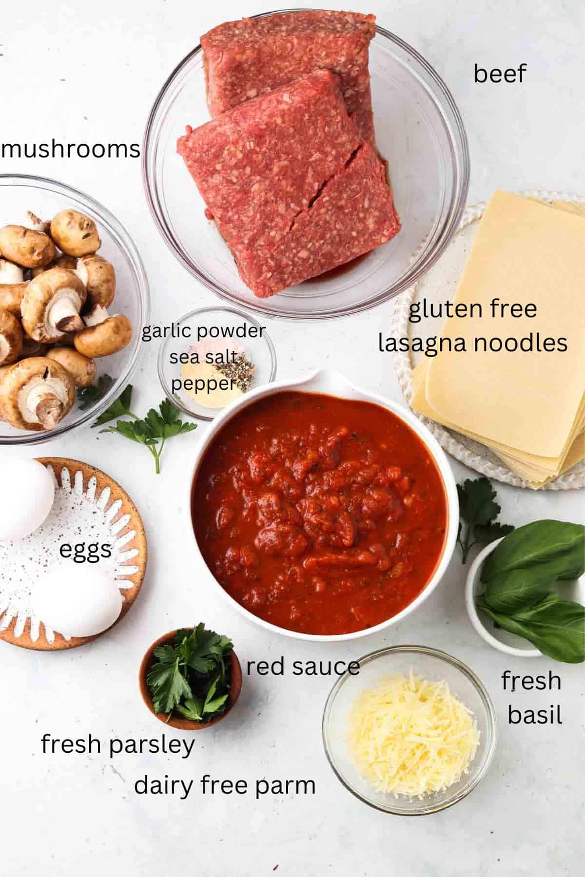 Gluten free lasagna noodle ingredients laid out in small glass bowls.