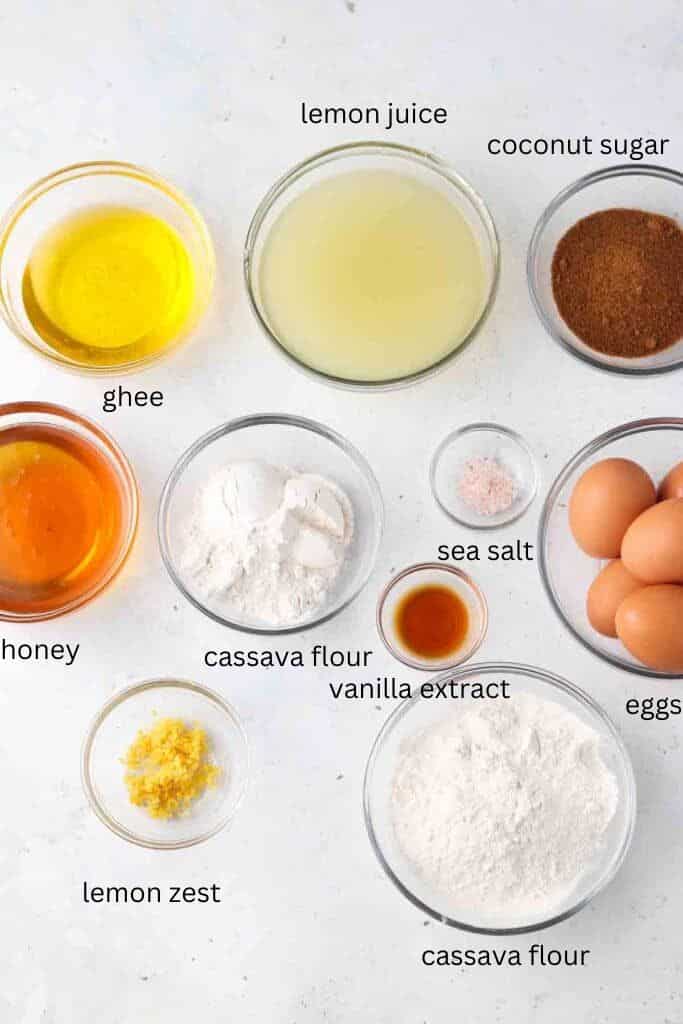 Ingredients for gluten free lemon bars in glass bowls on a table.