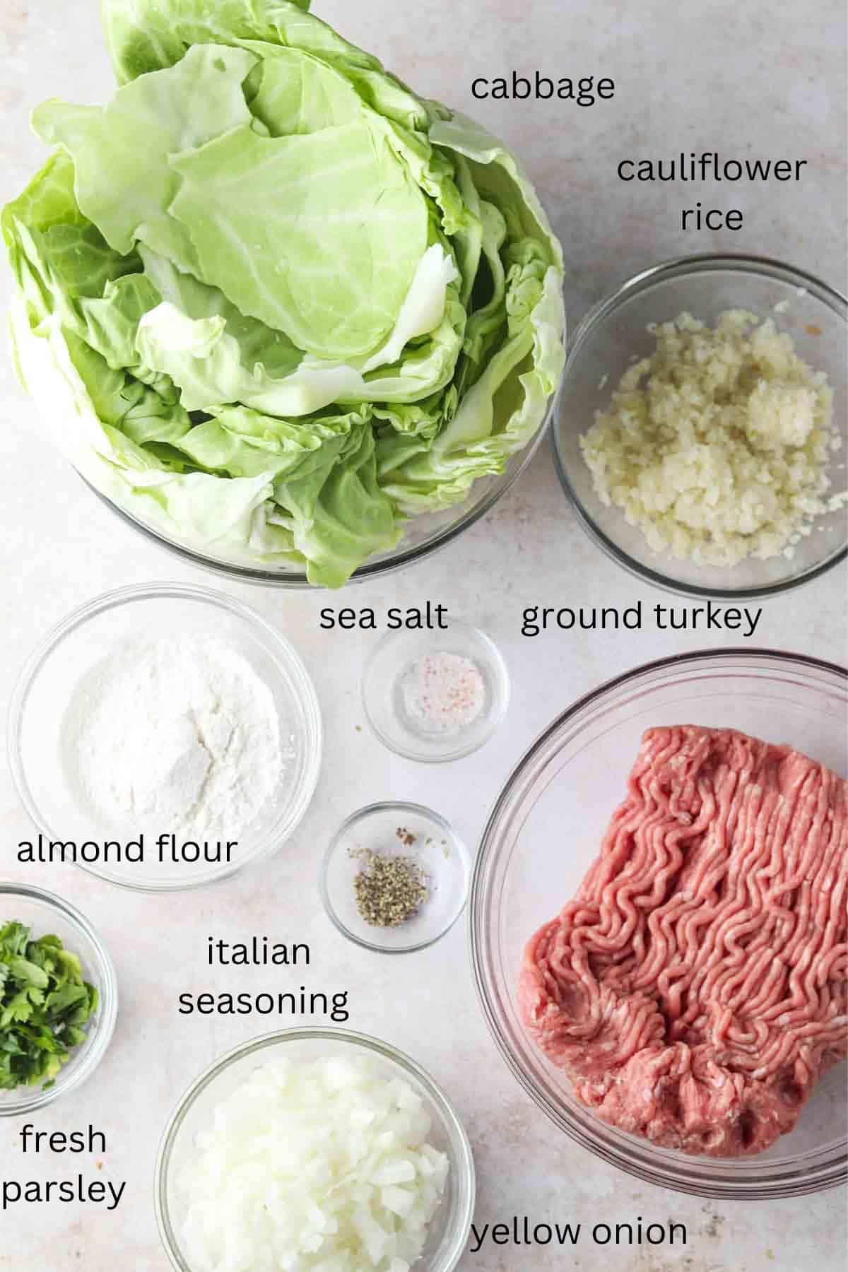 Keto cabbage roll ingredients laid out in small glass bowls.