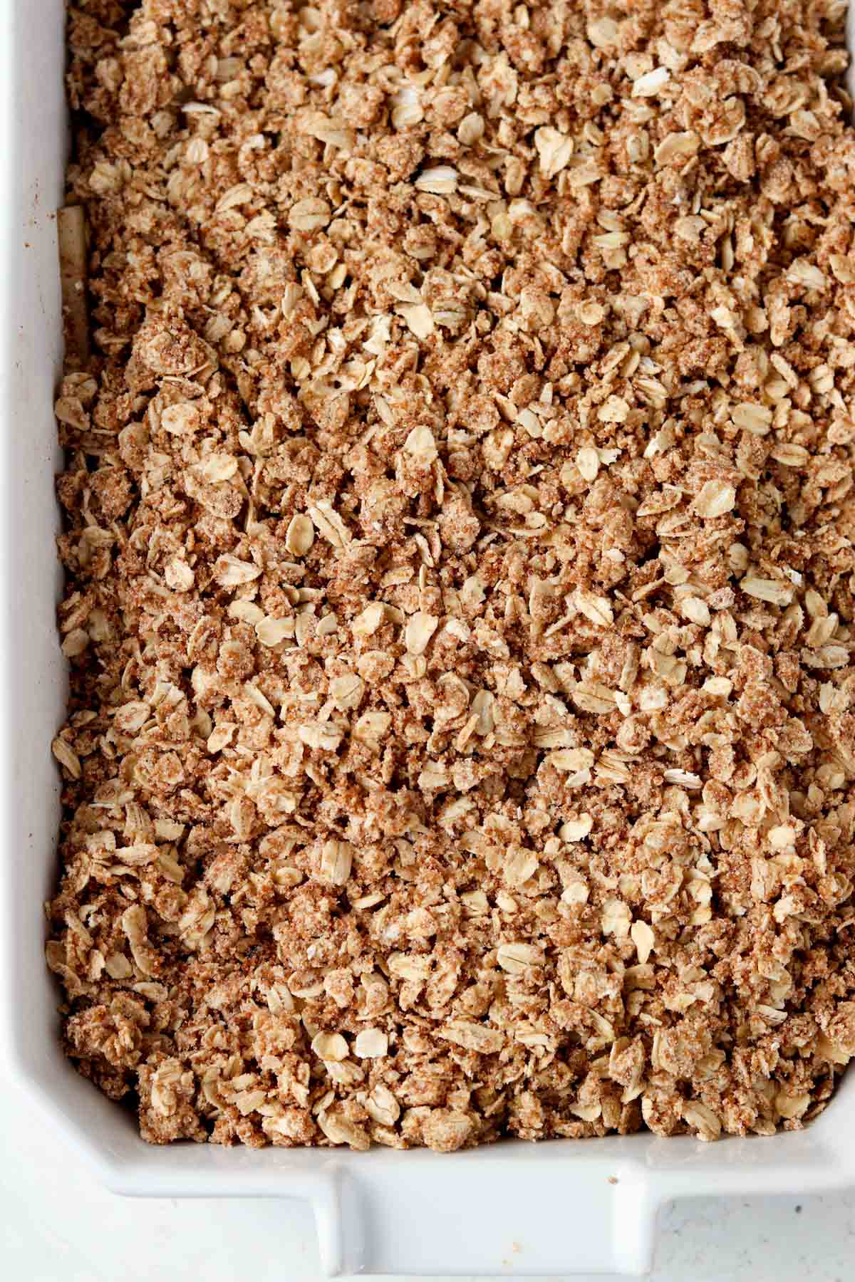 Oat topping on top of the blueberries and apples. 