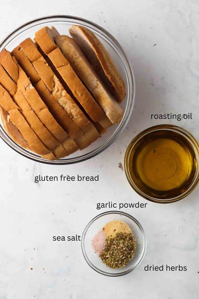 Ingredients for croutons in glass bowls on a tabletop.