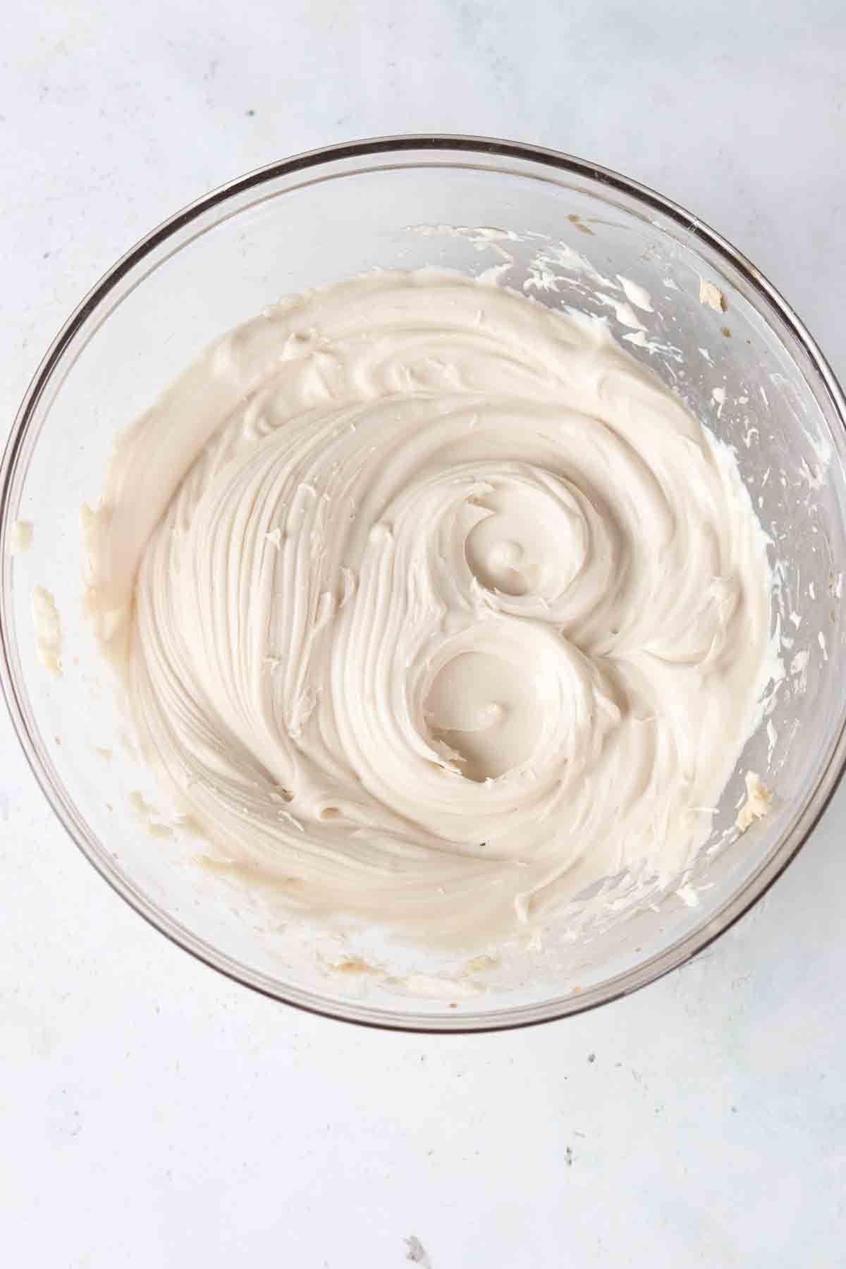 Whipped frosting in a bowl.