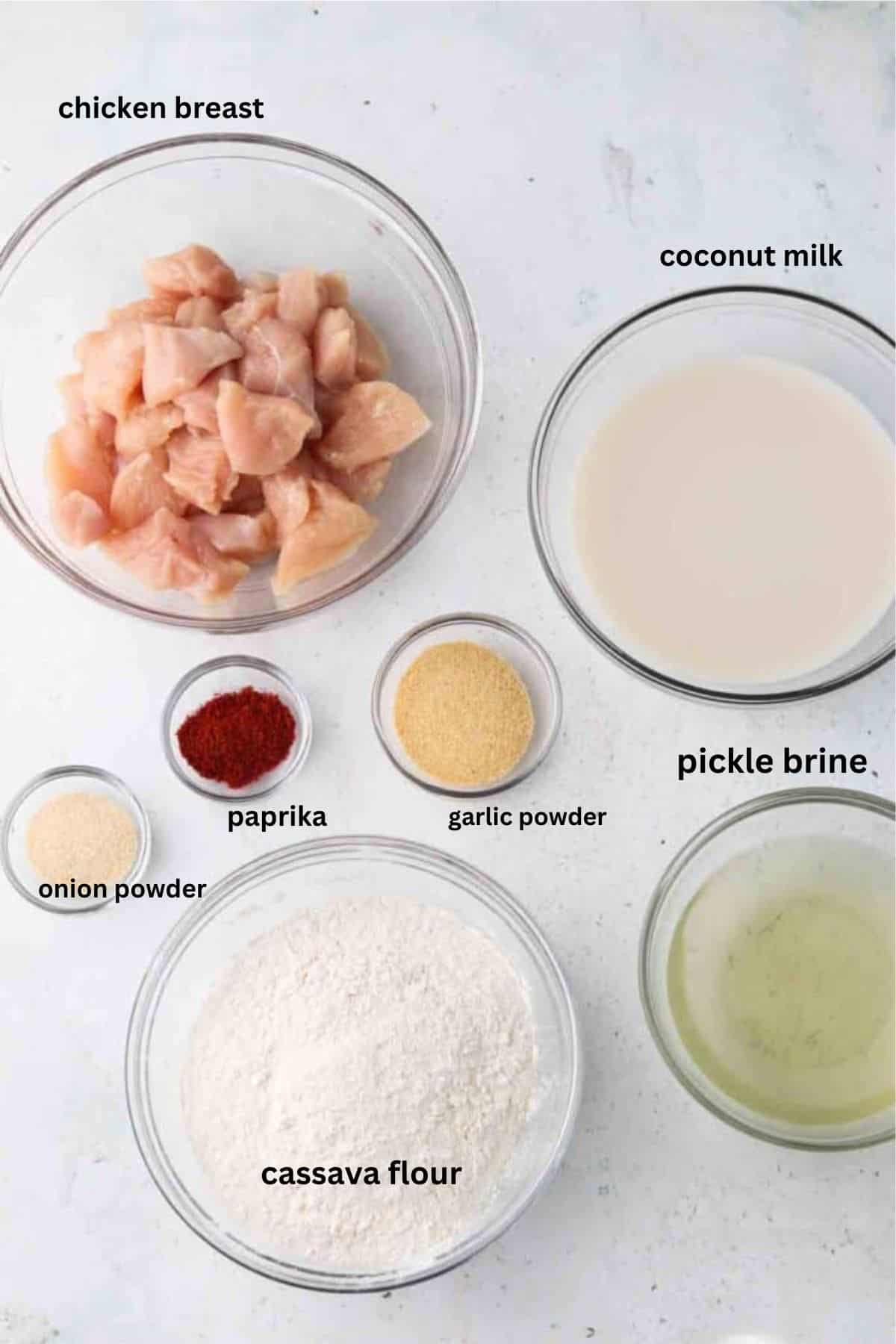 Air fryer chicken nugget ingredients in glass bowls.