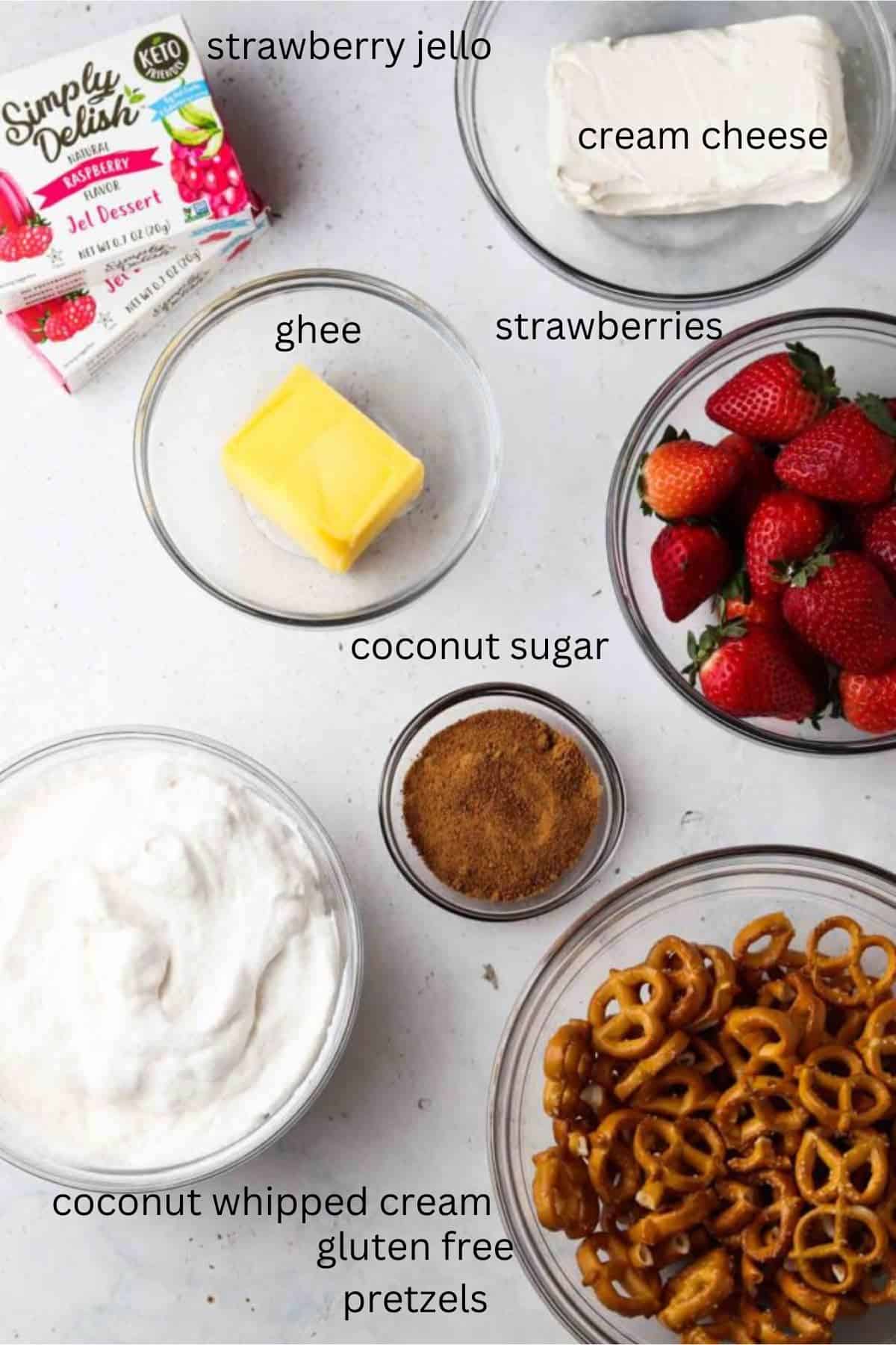 Gluten free strawberry pretzel salad ingredients in small glass bowls. 