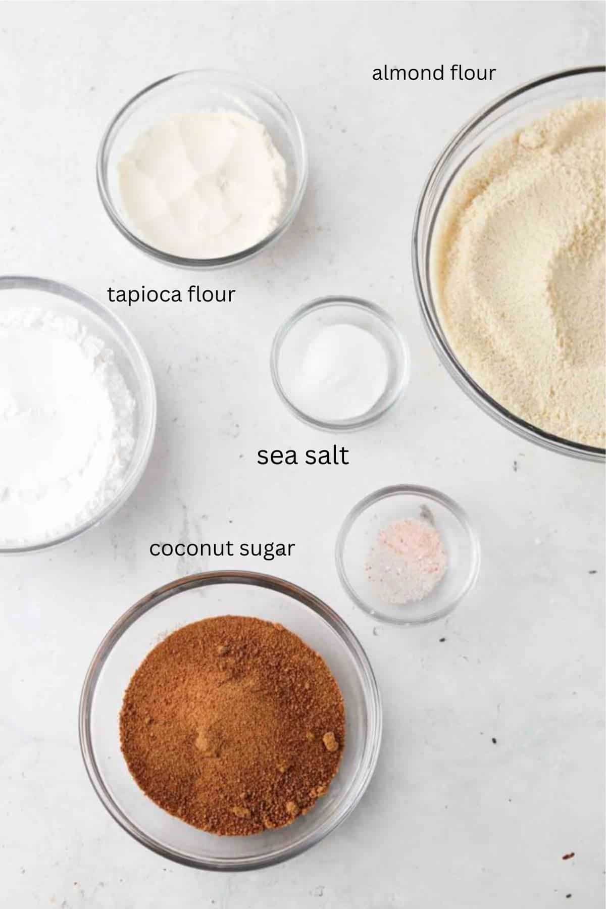 Strawberry cupcake dry ingredients in glass bowls.