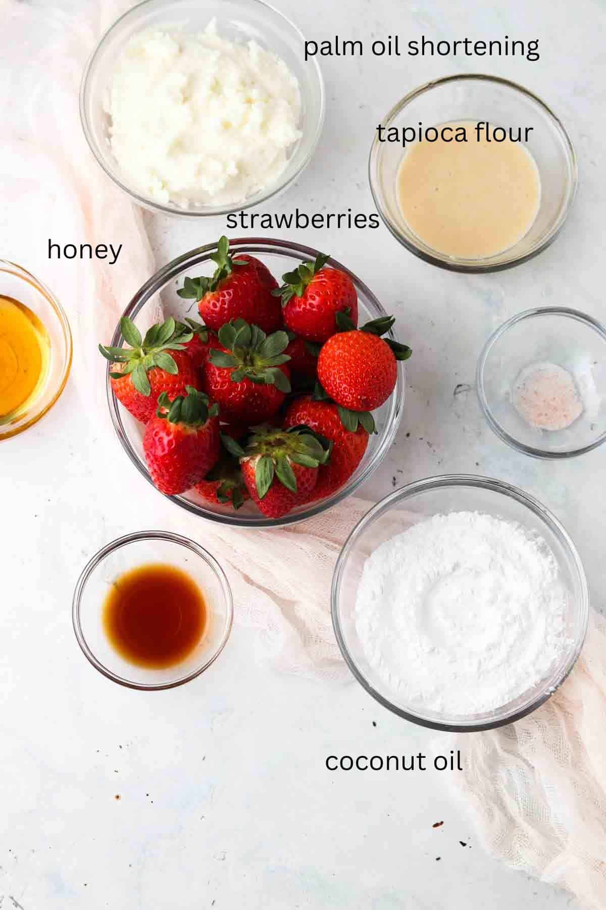 Strawberry cupcake frosting ingredients in glass bowls. 