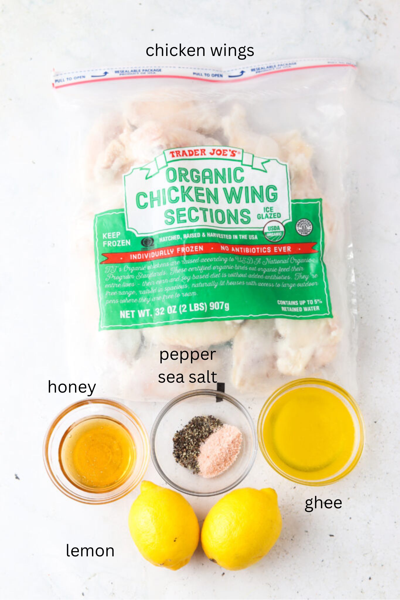 Honey lemon pepper chicken wing ingredients in glass bowls.