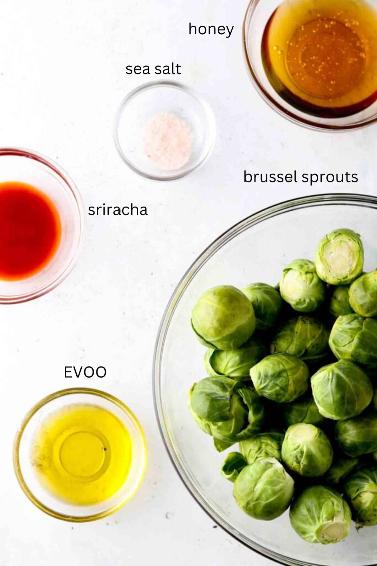 Honey sriracha brussel sprout ingredients in small glass bowls.