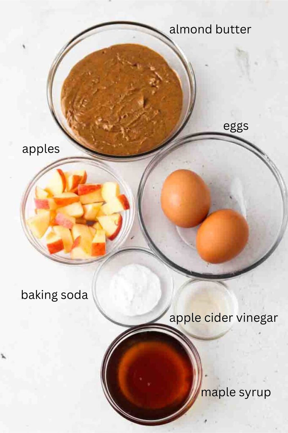 Gluten free apple muffin ingredients in small glass bowls.