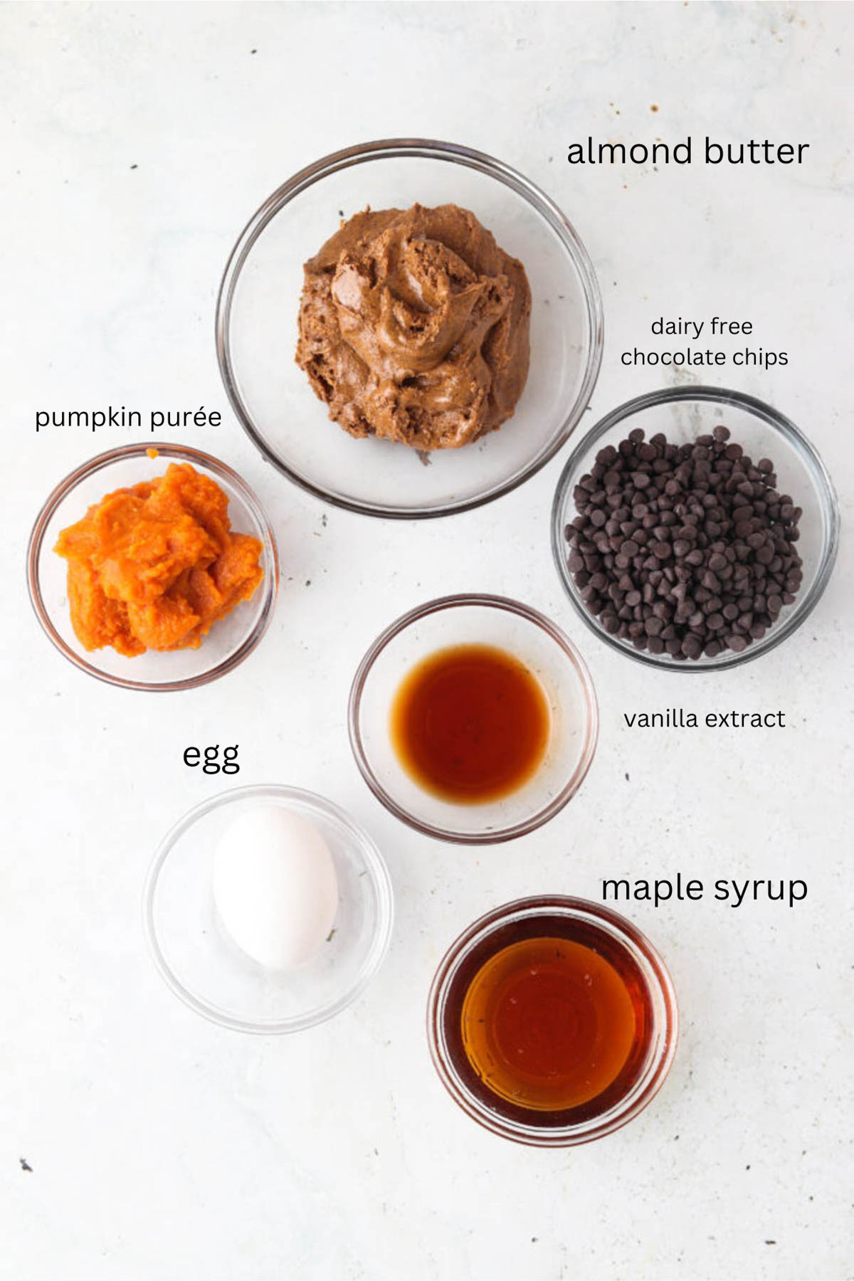 Gluten free pumpkin cookie ingredients in small glass bowls.