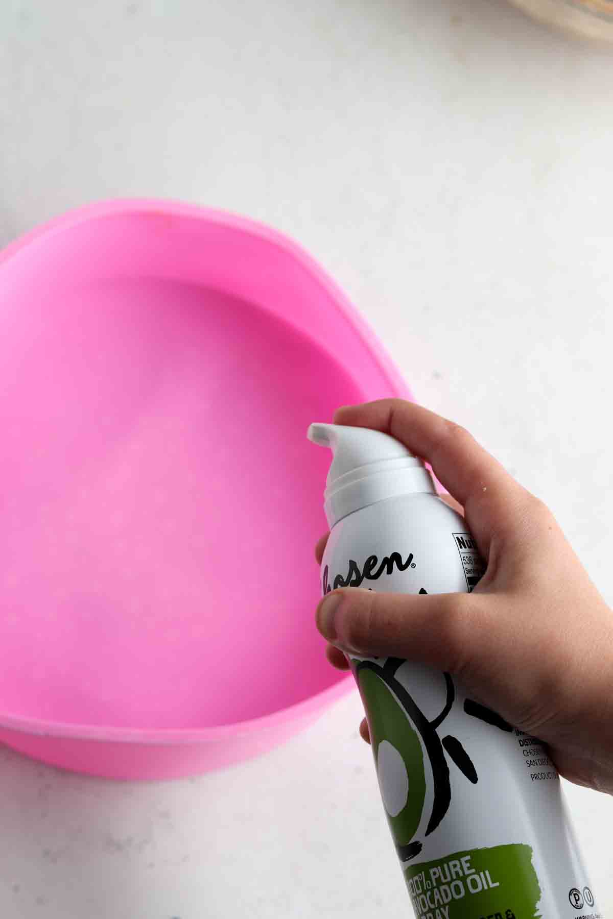 9 inch pink silicone baking cake pan with avocado oil spray.