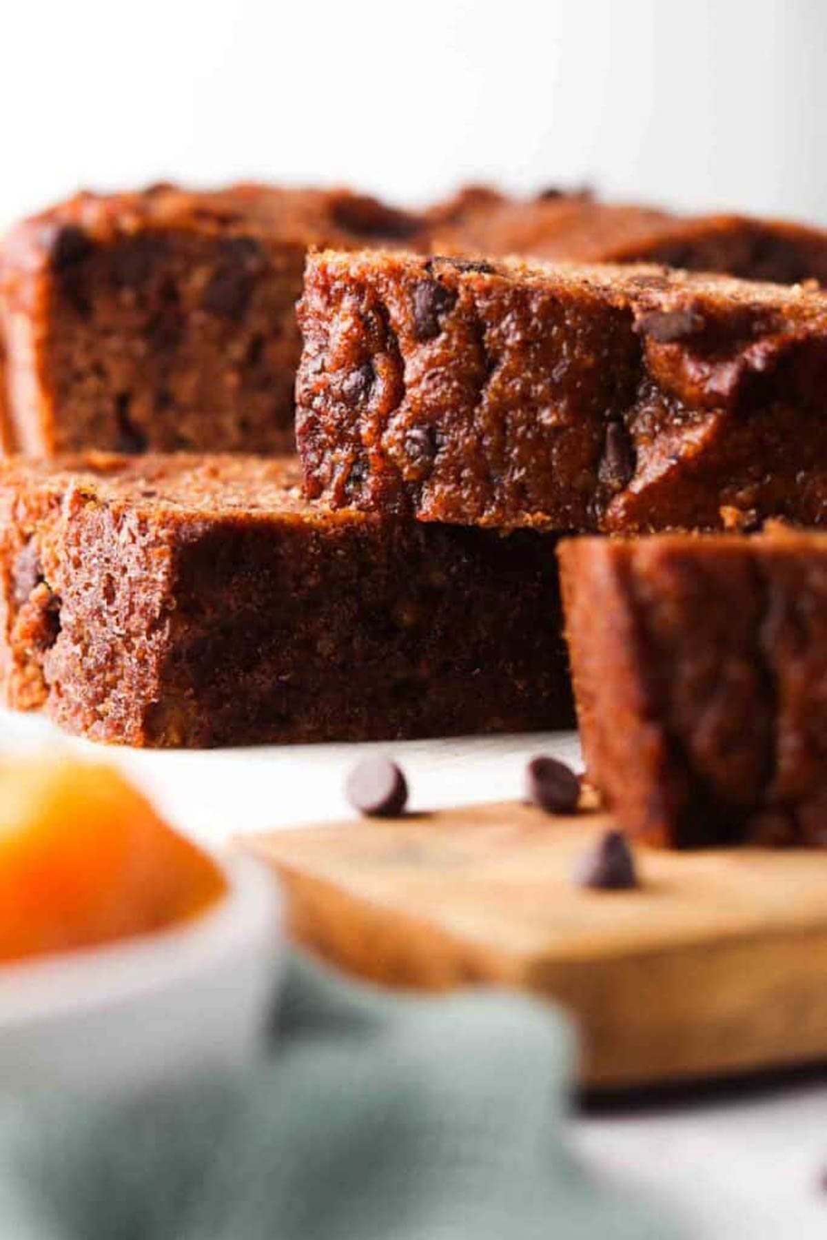 Gluten free pumpkin bread sliced on a surface and stacked together. 