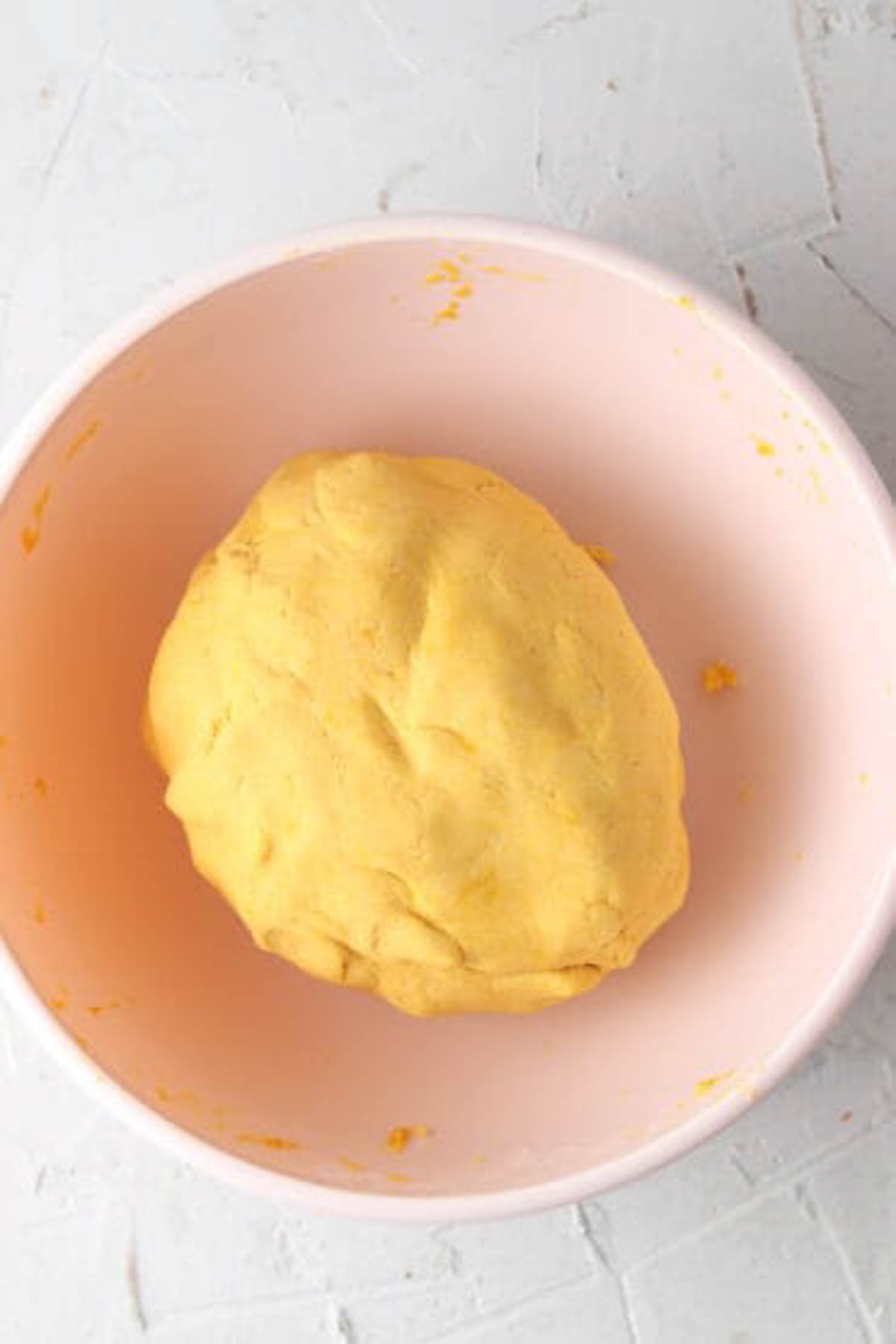 Gluten free ravioli dough ball in a bowl.