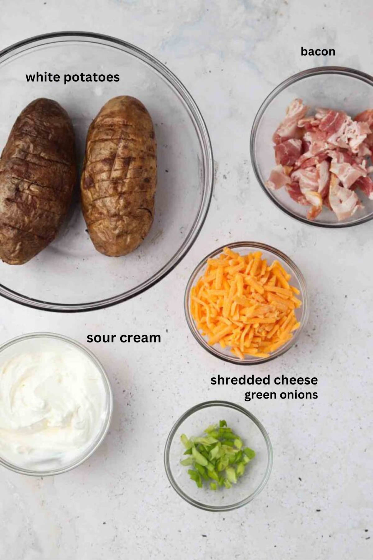 Air fryer potato skin ingredients in small glass bowls. 