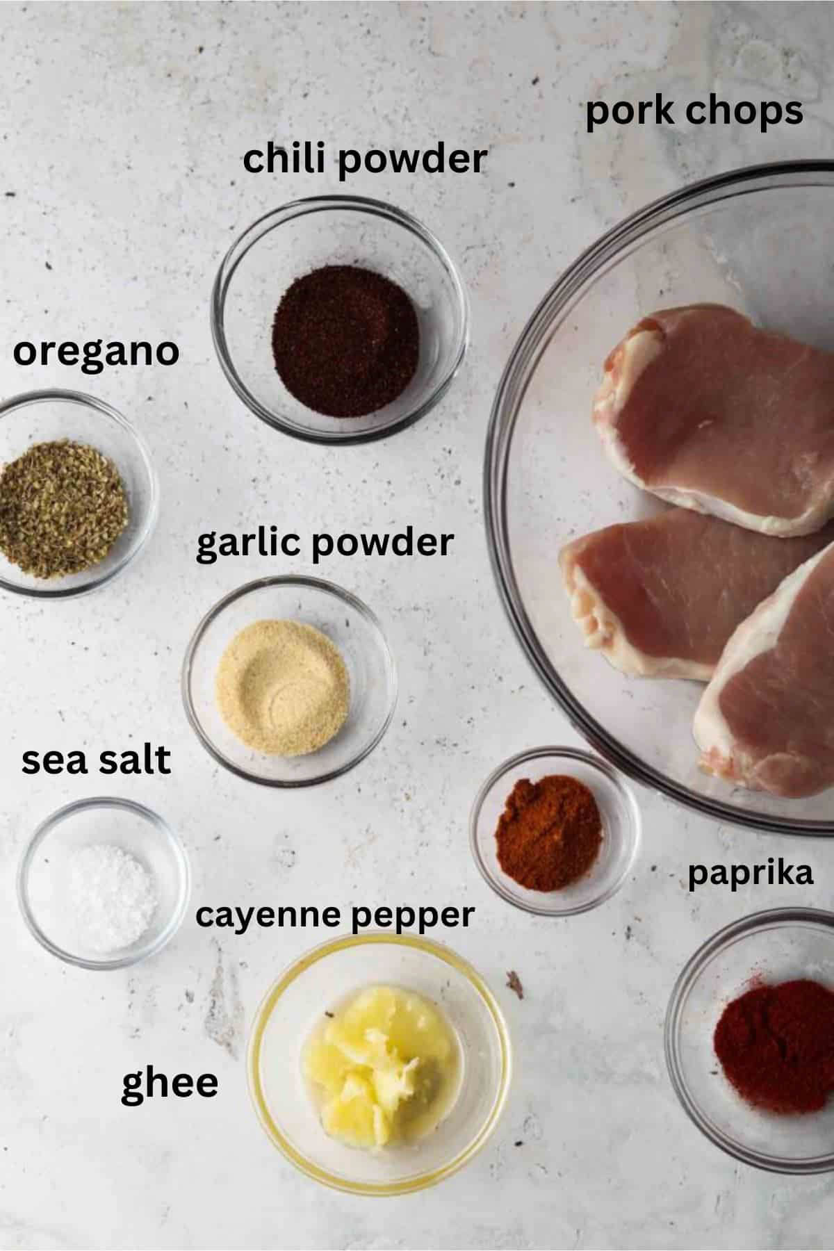Blackened pork chop ingredients in small glass bowls. 