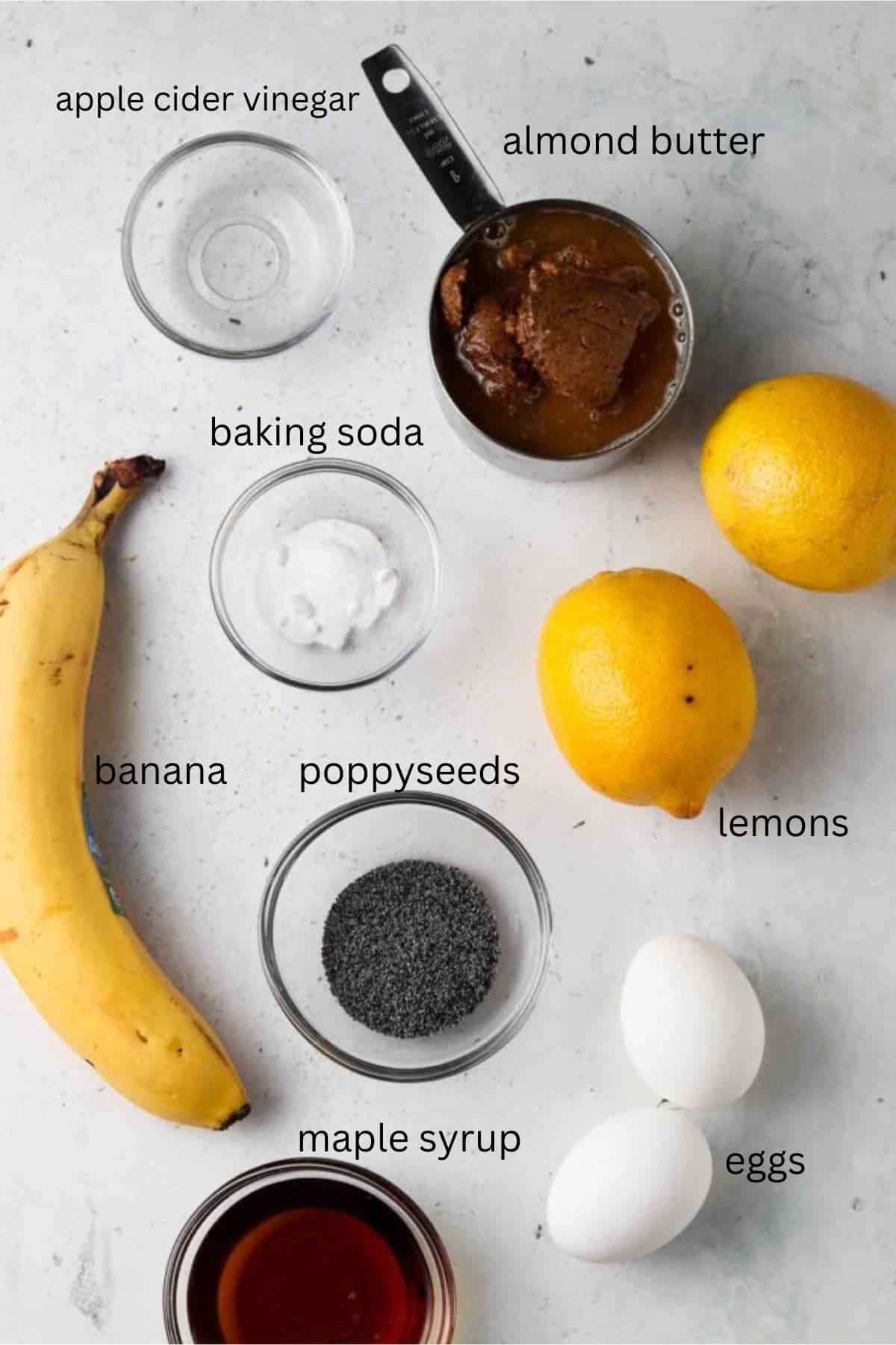 Healthy lemon poppyseed muffin ingredients in small glass bowls.