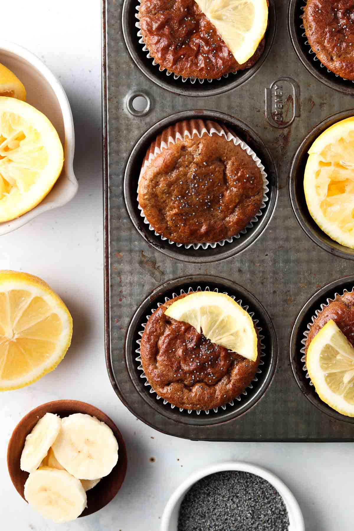 Lemon poppyseed muffins in muffin pan.