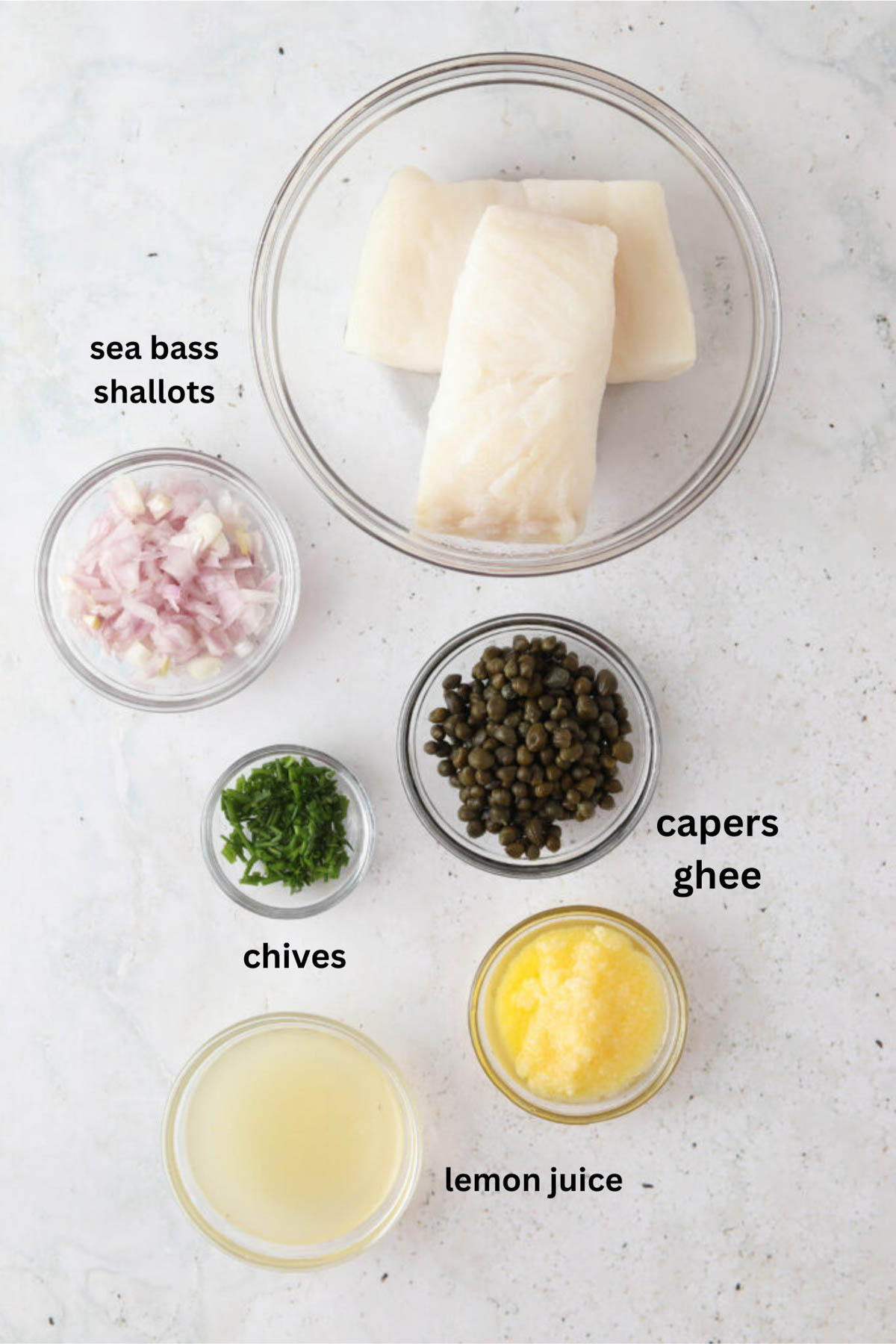Pan seared chilean sea bass ingredients in small glass bowls. 